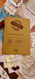 Brown case file 'Top Secret: Revenge or Betrayal' by Crime Lab on a textured surface with papers and tags.
